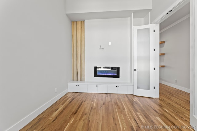 unfurnished bedroom featuring light wood-type flooring