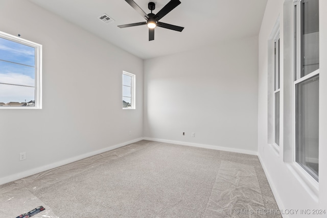 carpeted empty room with ceiling fan