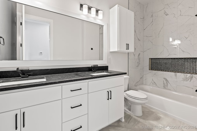 full bathroom with vanity, toilet, and tiled shower / bath