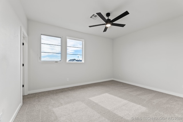 unfurnished room with ceiling fan and carpet flooring