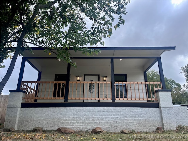 back of house with covered porch