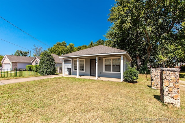 bungalow with a front lawn and covered porch