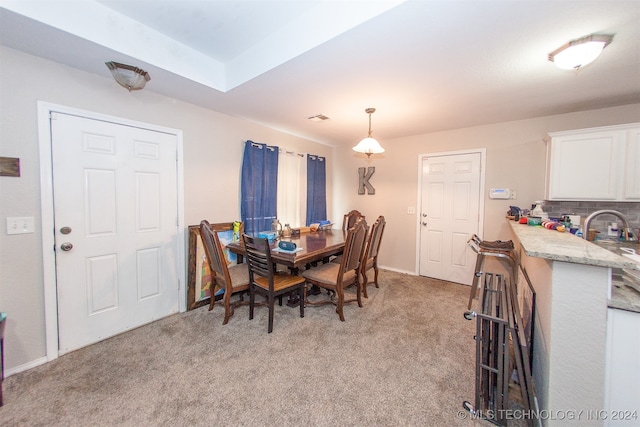 dining area with light carpet