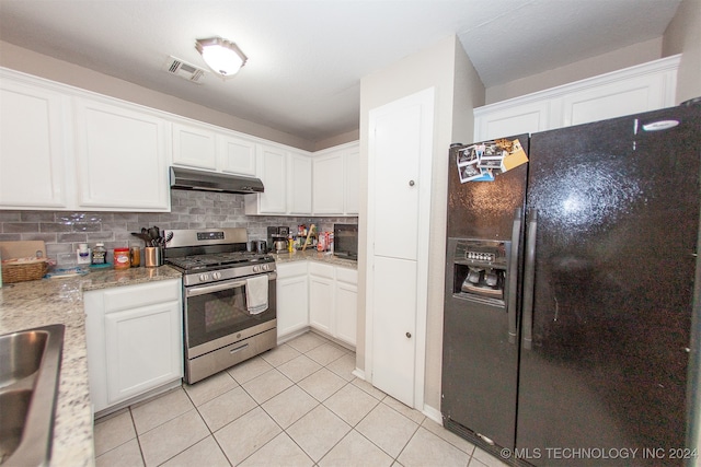 kitchen with light stone counters, white cabinets, backsplash, and black appliances