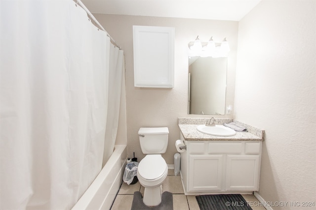 full bathroom featuring shower / bath combo, tile patterned flooring, vanity, and toilet