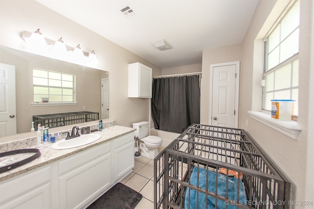 bathroom featuring tile patterned flooring, vanity, toilet, and a shower with shower curtain