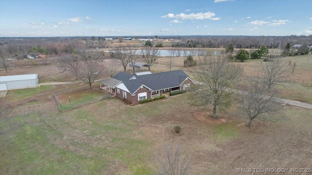 birds eye view of property with a rural view