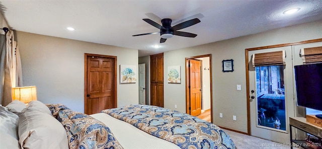 carpeted bedroom with ceiling fan