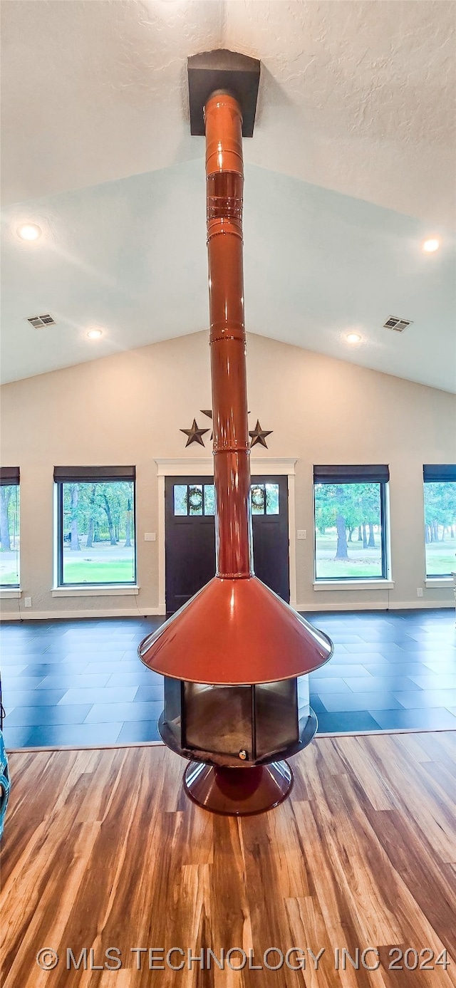 rec room with hardwood / wood-style floors and vaulted ceiling