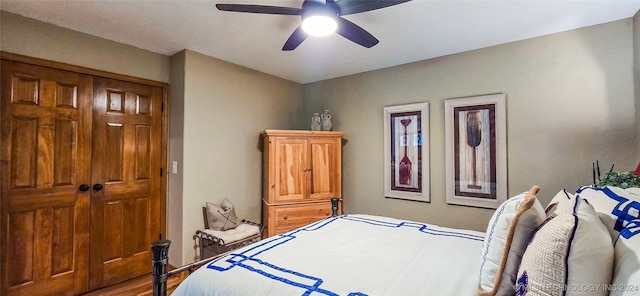 bedroom featuring ceiling fan, a closet, and wood-type flooring