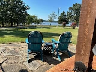 view of patio / terrace featuring a water view