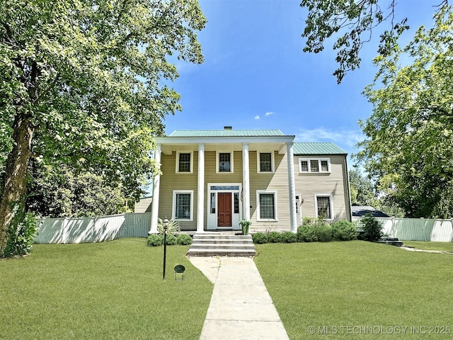 greek revival house featuring a front lawn