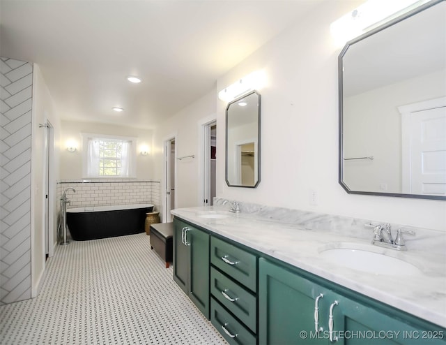 bathroom featuring a bathtub and vanity