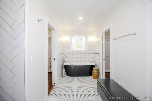 bathroom with a washtub