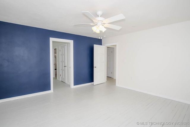 empty room featuring ceiling fan