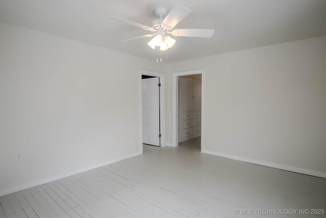 spare room with ceiling fan