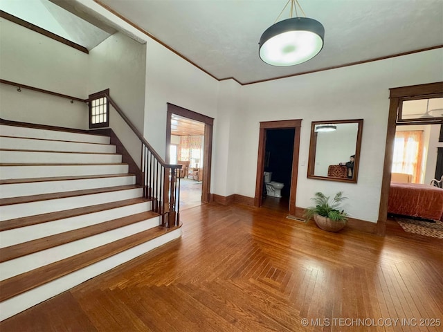 interior space featuring parquet floors and ornamental molding