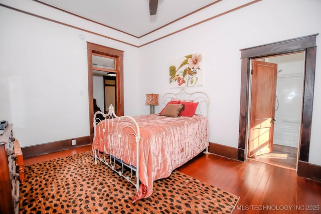 bedroom with hardwood / wood-style flooring, ceiling fan, and crown molding