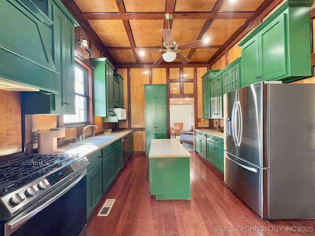 kitchen featuring a kitchen island, green cabinets, stainless steel appliances, and coffered ceiling