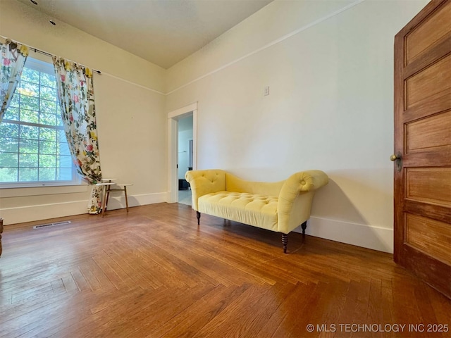 living area featuring parquet floors