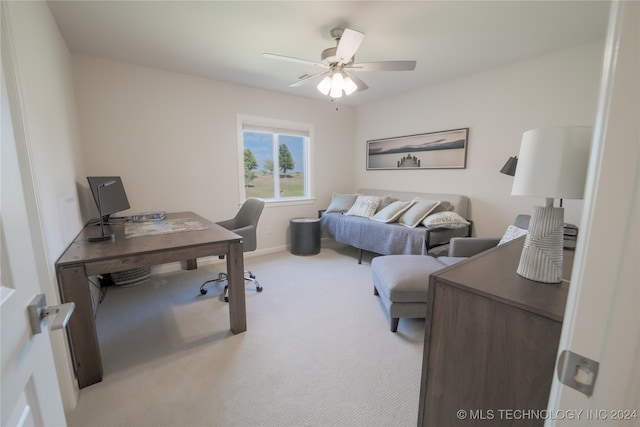 home office featuring ceiling fan and light carpet