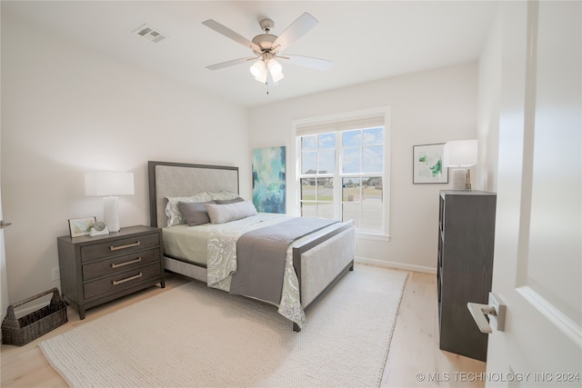 bedroom featuring light hardwood / wood-style floors and ceiling fan