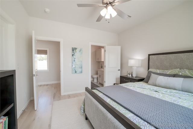 bedroom with light hardwood / wood-style flooring, connected bathroom, and ceiling fan