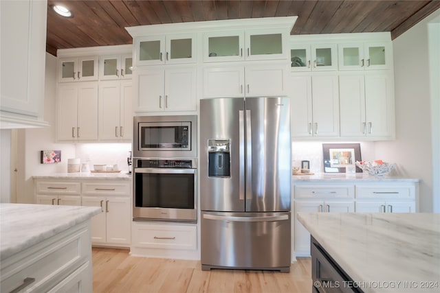 kitchen with wooden ceiling, light stone countertops, stainless steel appliances, and white cabinets