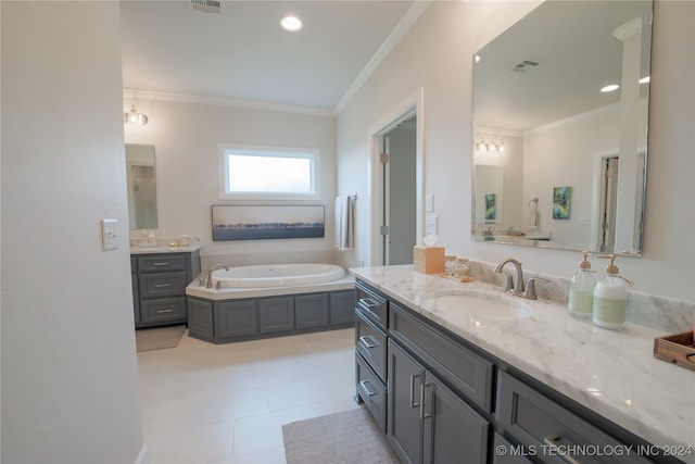 bathroom with ornamental molding, tile patterned floors, a washtub, and vanity