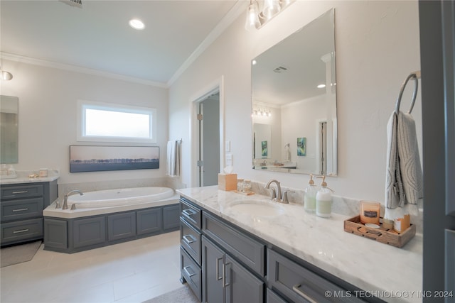 bathroom featuring vanity, a bathtub, crown molding, and tile patterned floors