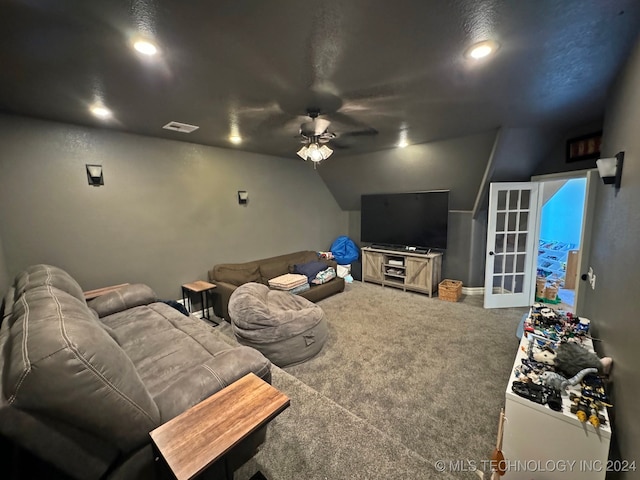 living room with carpet, vaulted ceiling, and ceiling fan