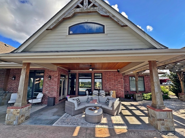 back of house with an outdoor hangout area, ceiling fan, and a patio area