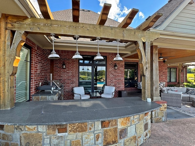 view of patio / terrace with ceiling fan, an outdoor hangout area, an outdoor kitchen, and a grill