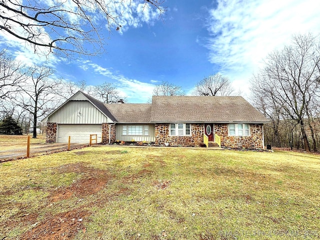 ranch-style house with a garage, driveway, roof with shingles, a front lawn, and board and batten siding