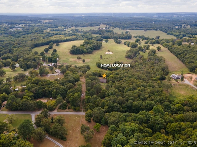 birds eye view of property with a rural view