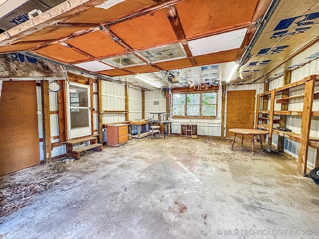 misc room featuring unfinished concrete flooring