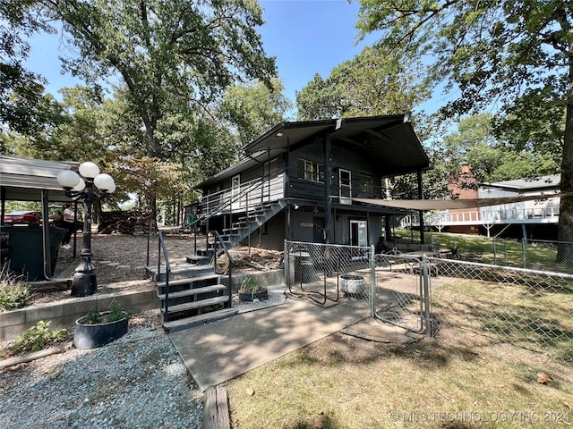 exterior space featuring a wooden deck and a patio area