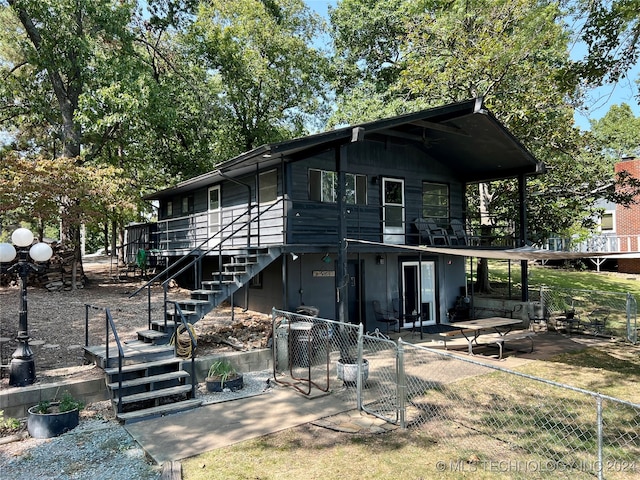 exterior space featuring a deck and a patio area