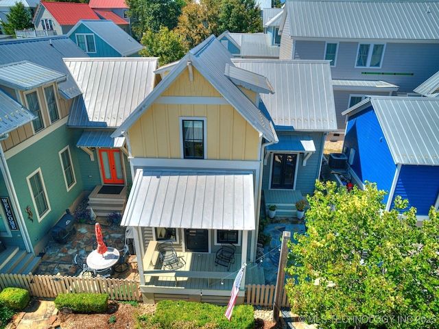 back of house featuring central AC unit