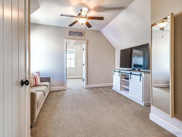 unfurnished living room with lofted ceiling, light carpet, and ceiling fan