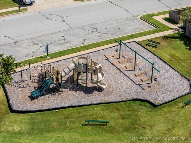 view of playground featuring a lawn