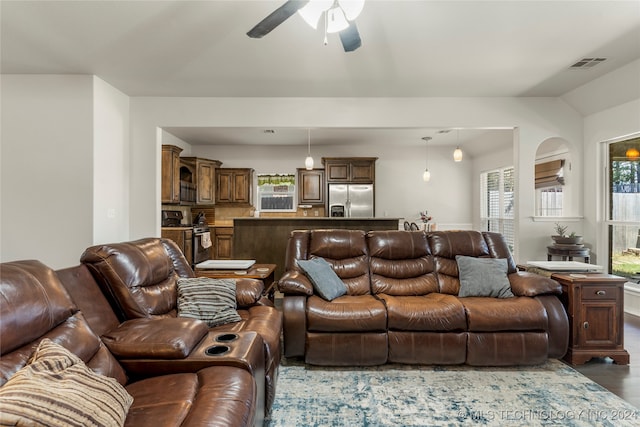 living room featuring dark hardwood / wood-style floors and ceiling fan