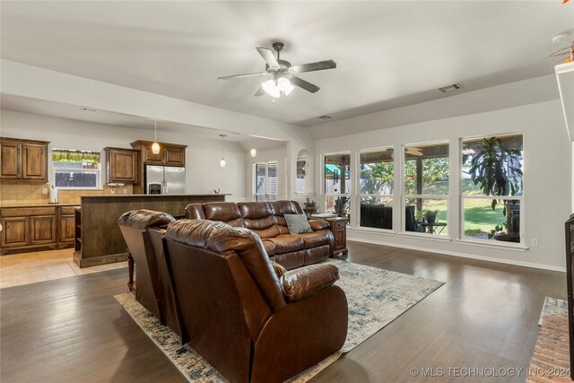 living room featuring dark hardwood / wood-style floors and ceiling fan