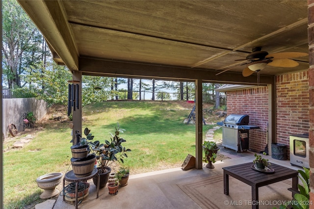 view of patio featuring a grill and ceiling fan