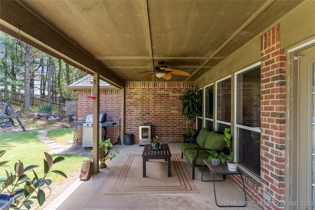 view of patio with ceiling fan and a grill