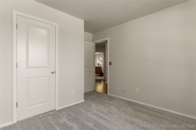 unfurnished bedroom with light carpet