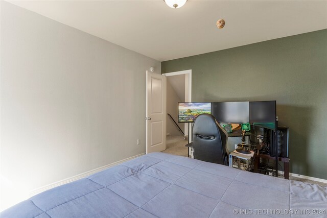 bedroom with light carpet