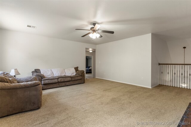 living room with carpet flooring and ceiling fan