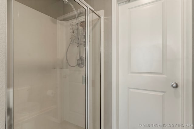 bathroom featuring an enclosed shower