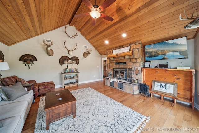 living room featuring a fireplace, wooden ceiling, ceiling fan, vaulted ceiling with beams, and hardwood / wood-style floors